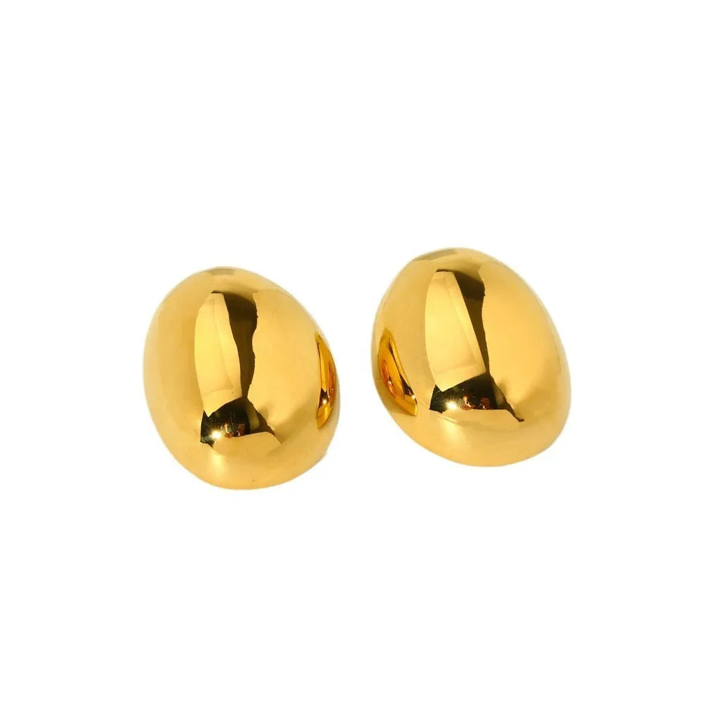 Geometric ear studs with 18K gold electroplating and exaggerated glazed surface showing linear design elements