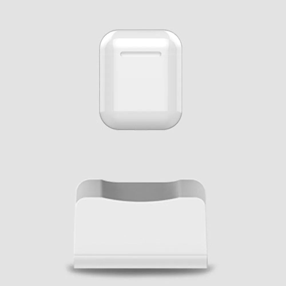 White headphone charging base station with fashion last design on flat surface