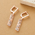 Rectangular two-tone hollow stud earrings for women with a geometric electroplated alloy design.