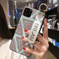 Rose floral wrist strap phone case for iPhone with secure strap attachment and decorative design.