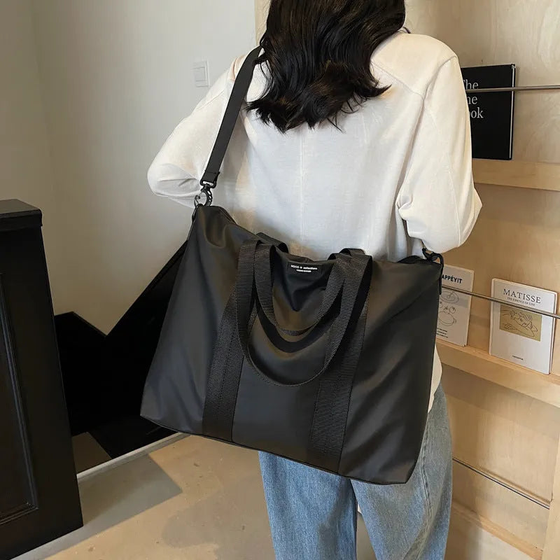 Lightweight Oxford cloth tote bag with 20-35 litre capacity in black colour option