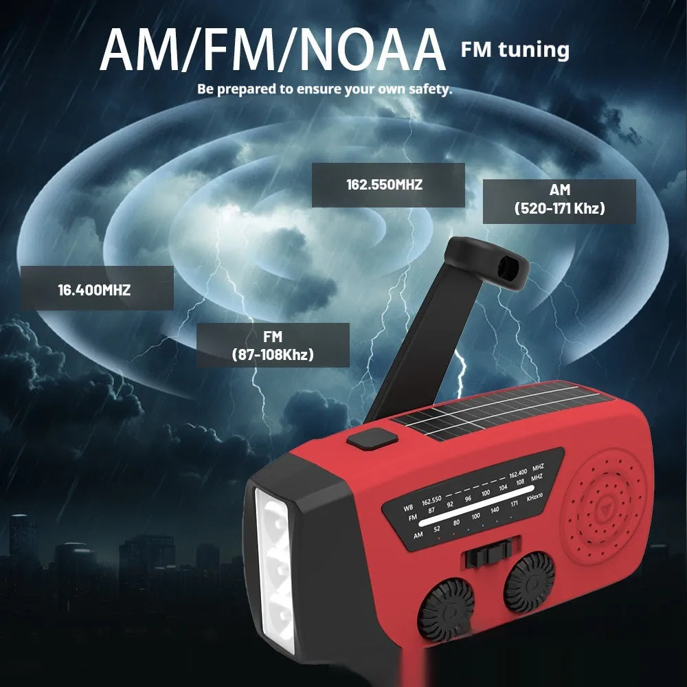 Red rechargeable handheld torch and radio with wrist strap and USB charging cable.