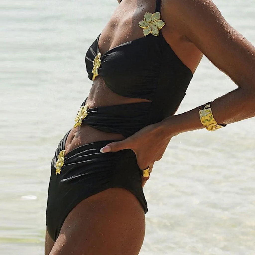Women's solid colour one-piece swimsuit with detachable skirt showing high-waist design and hollow-out tube top detail