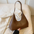 PU leather retro shoulder handbag in pillow shape with stitching details and single strap