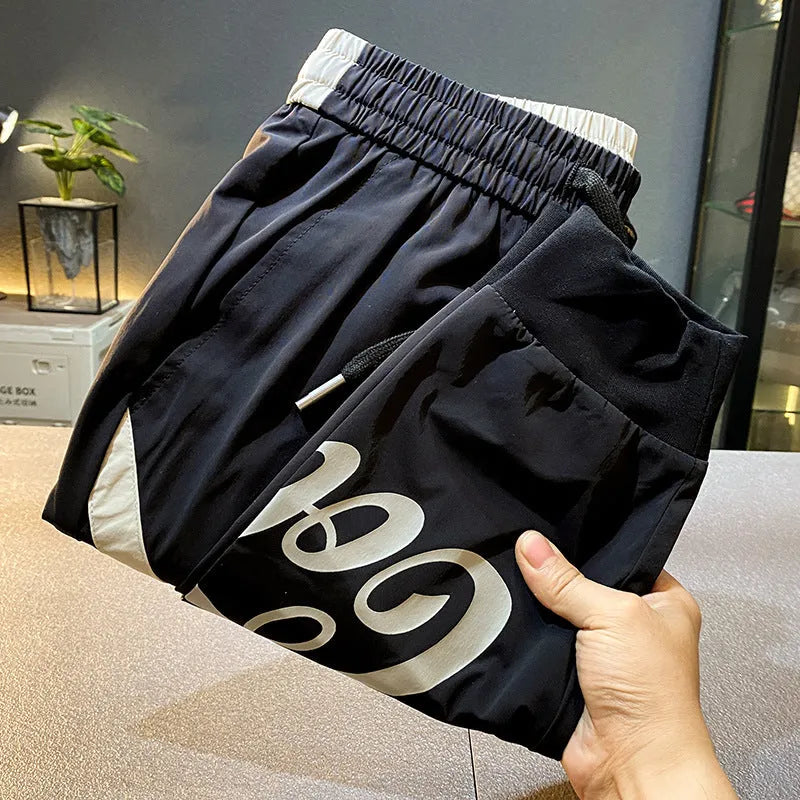 Black men's casual cropped trousers with elasticated ankle bands made from ultra-thin ice silk cotton.