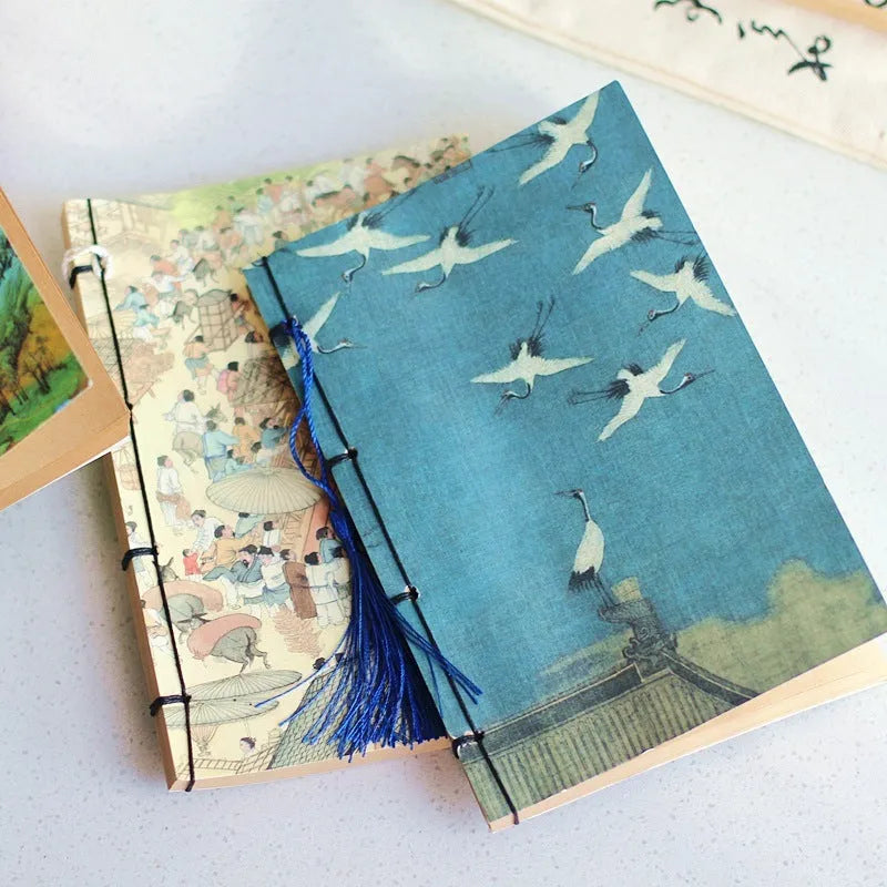 A5 antique-style wire-bound notebook with vintage Chinese painting cover, thread binding, and black wax rope tassel.