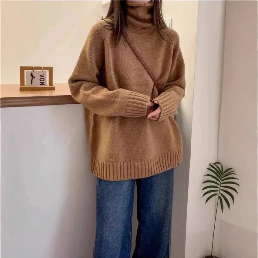 Women's loose-fit grey turtleneck sweater with thick curling pile collar, made of polyester mesh fabric.