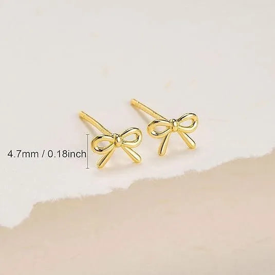 Women's geometric bow and cross stud earrings in gold and silver electroplated finishes
