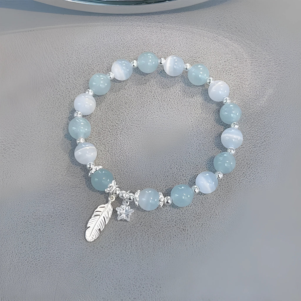 Korean style glass bracelet with feather XINGX blue moonlight colour and eight Awn star decorative elements