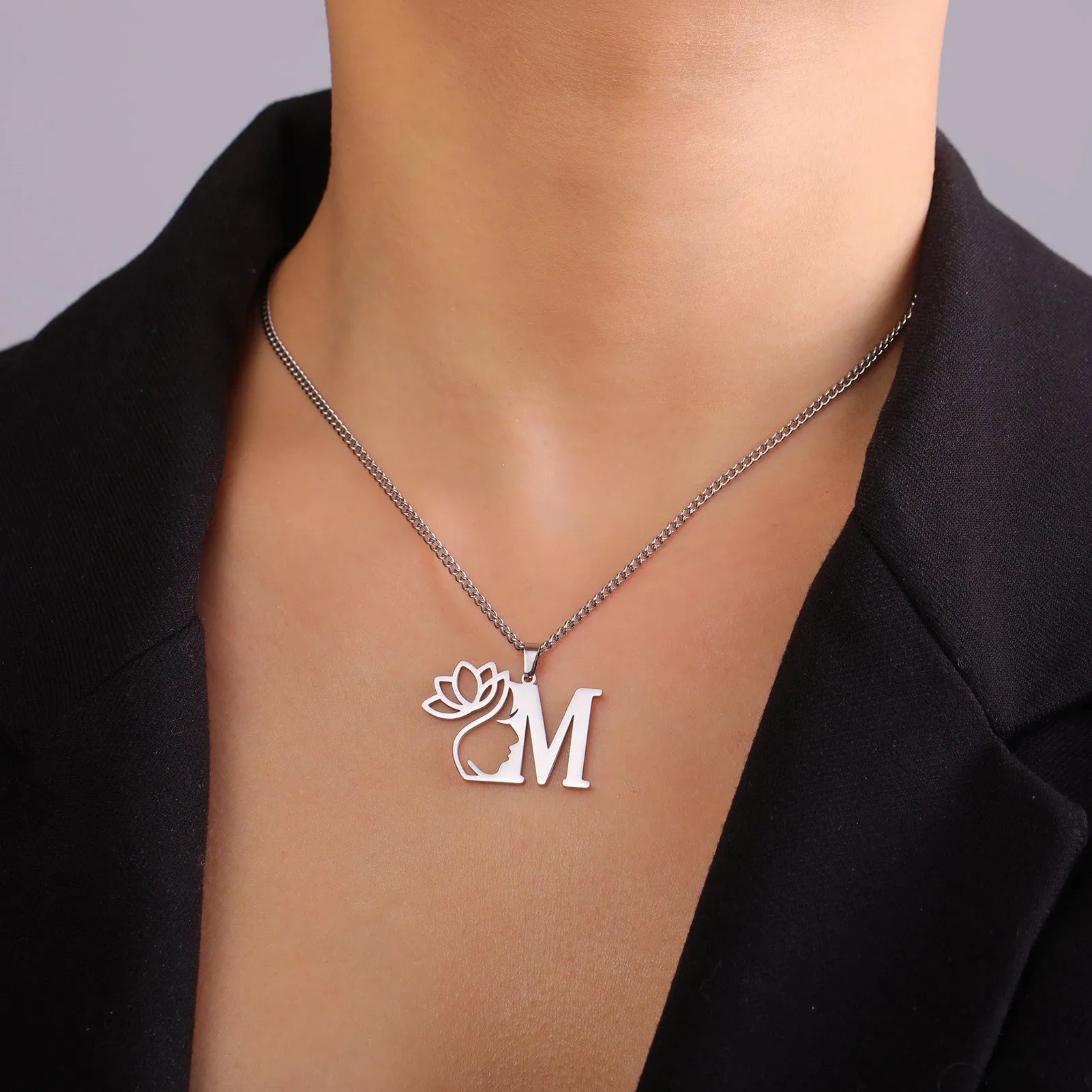 Stainless steel cross chain necklace with electroplated finish in gold or silver tone, showing pendant attachment and link detail