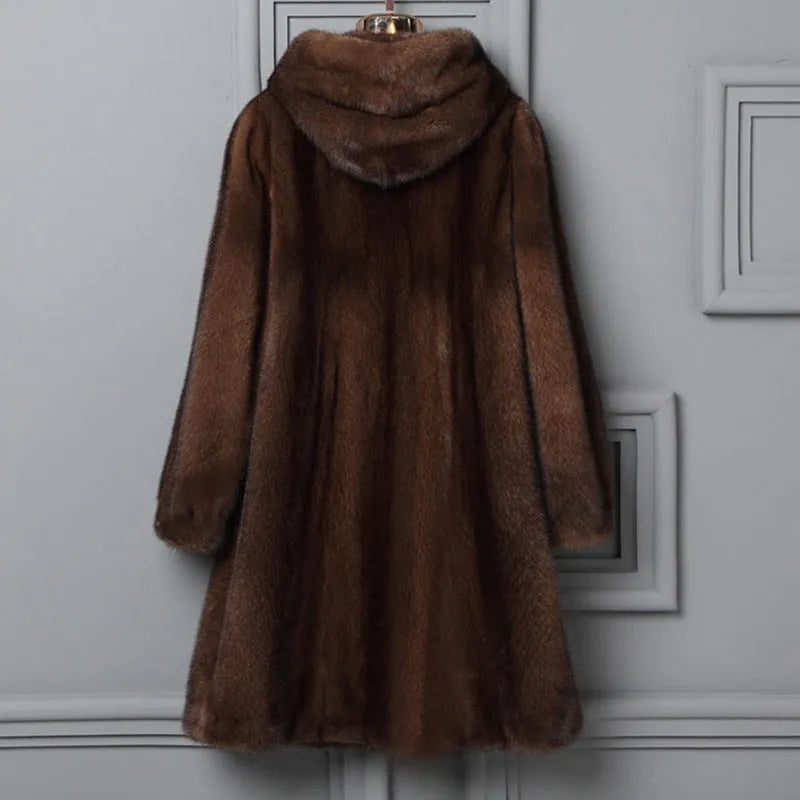 Women's long black hooded faux fur coat for autumn and winter, shown on a hanger.