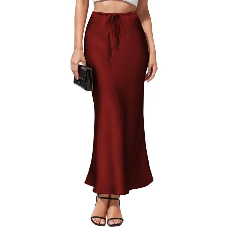 Women's high-waisted acetate satin skirt with an asymmetric irregular hem in a solid colour