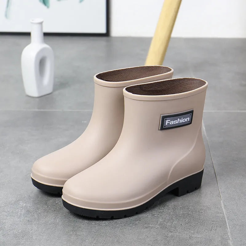 Women's PVC mid-calf rain boots in black, brown, apricot, and purple colours