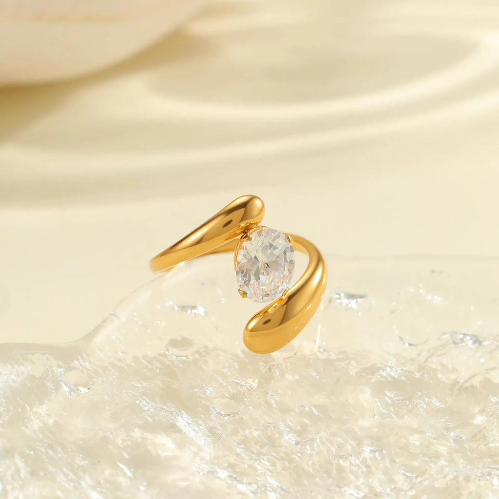 Adjustable stainless steel ring with geometric zircon shapes on a silver-toned band.