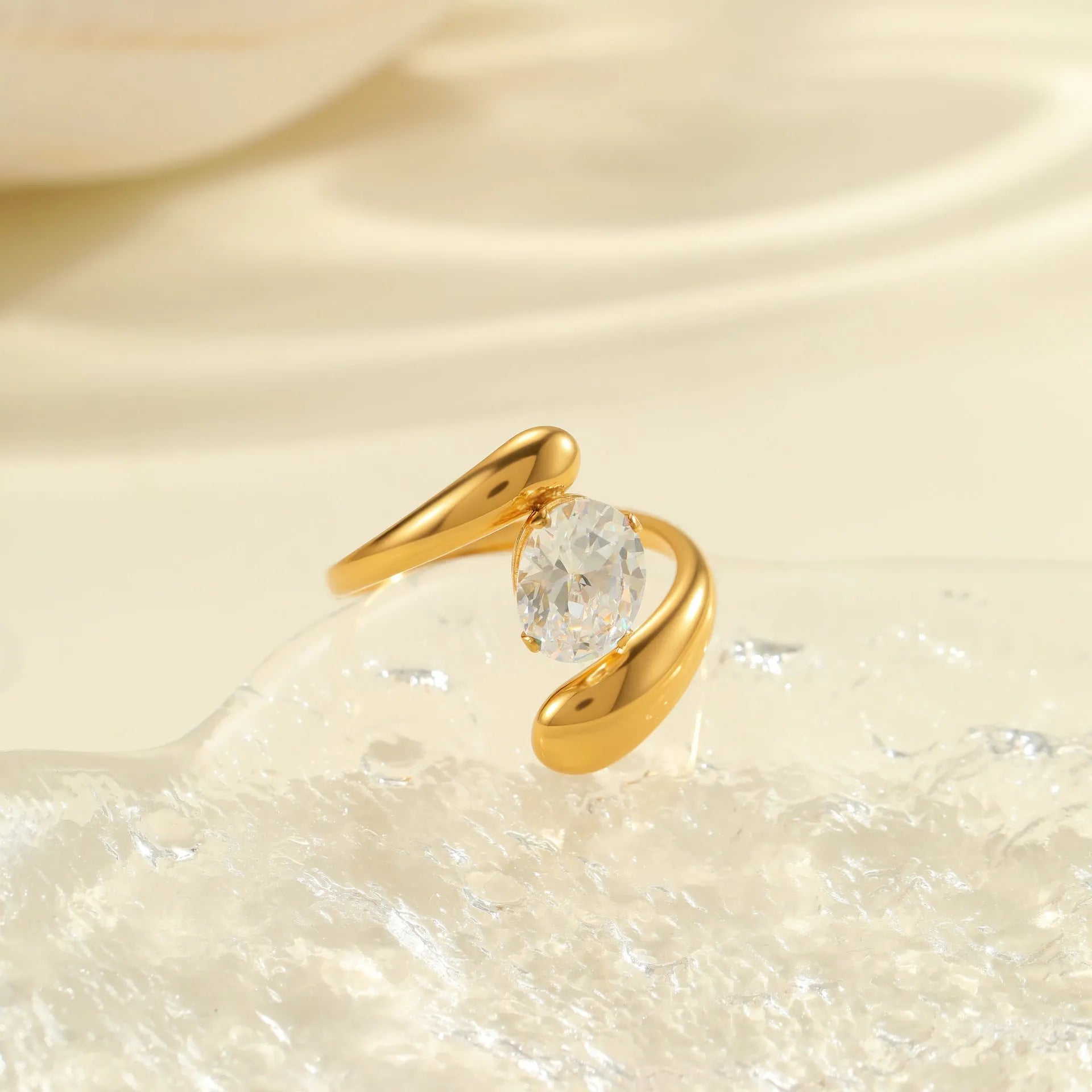 Adjustable stainless steel ring with geometric zircon shapes on a silver-toned band.