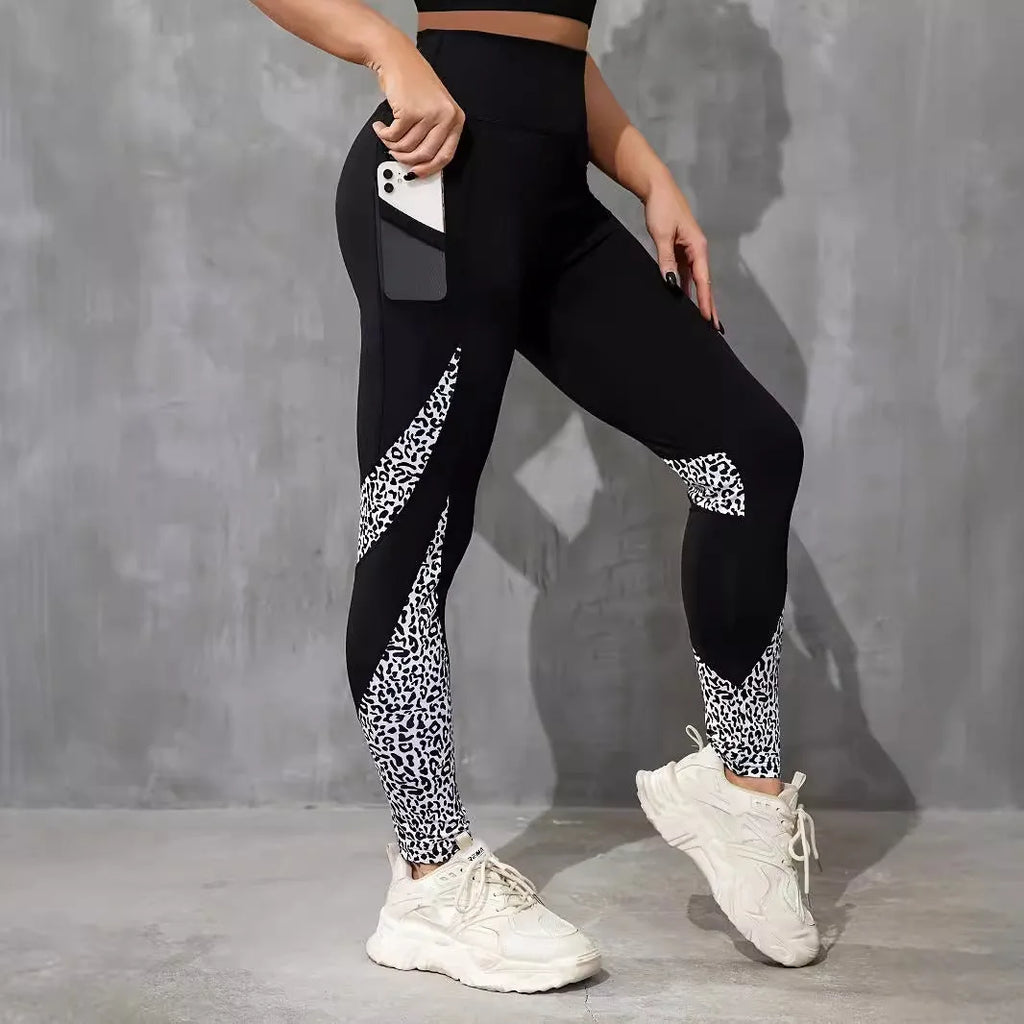 Women's black polyester yoga leggings with side pocket and leopard print pattern detail