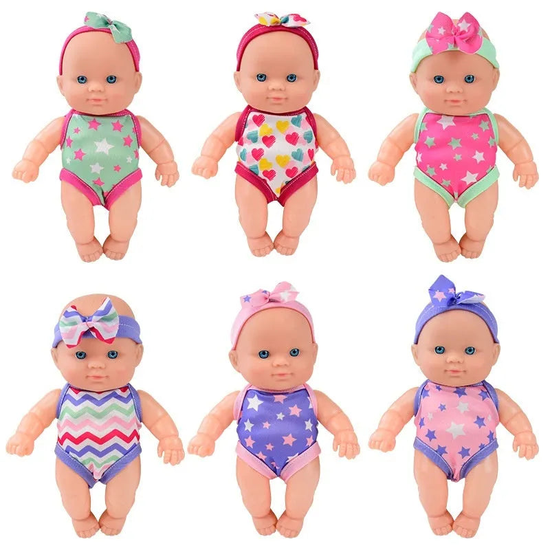 Simulation baby vinyl figurine doll displayed on a surface, showing detailed features.