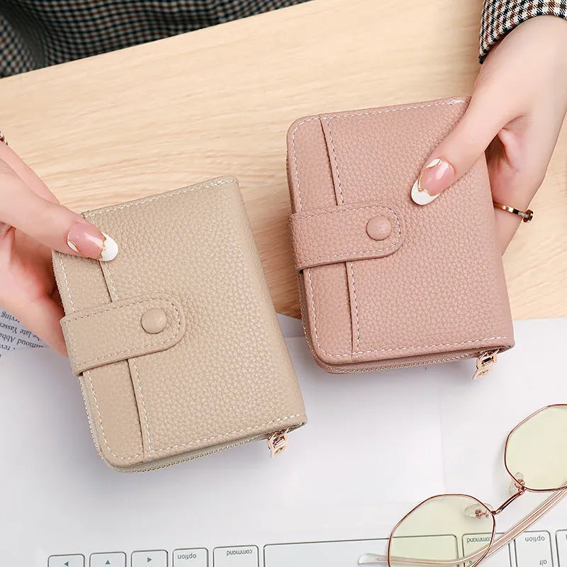 Ladies' short wallet with lychee pattern in beige, showing two-fold design and card slots