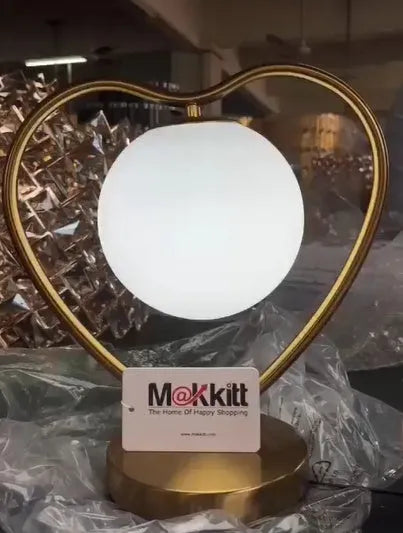 Heart-shaped table lamp with touch-sensitive base and 5W LED bulb on a table