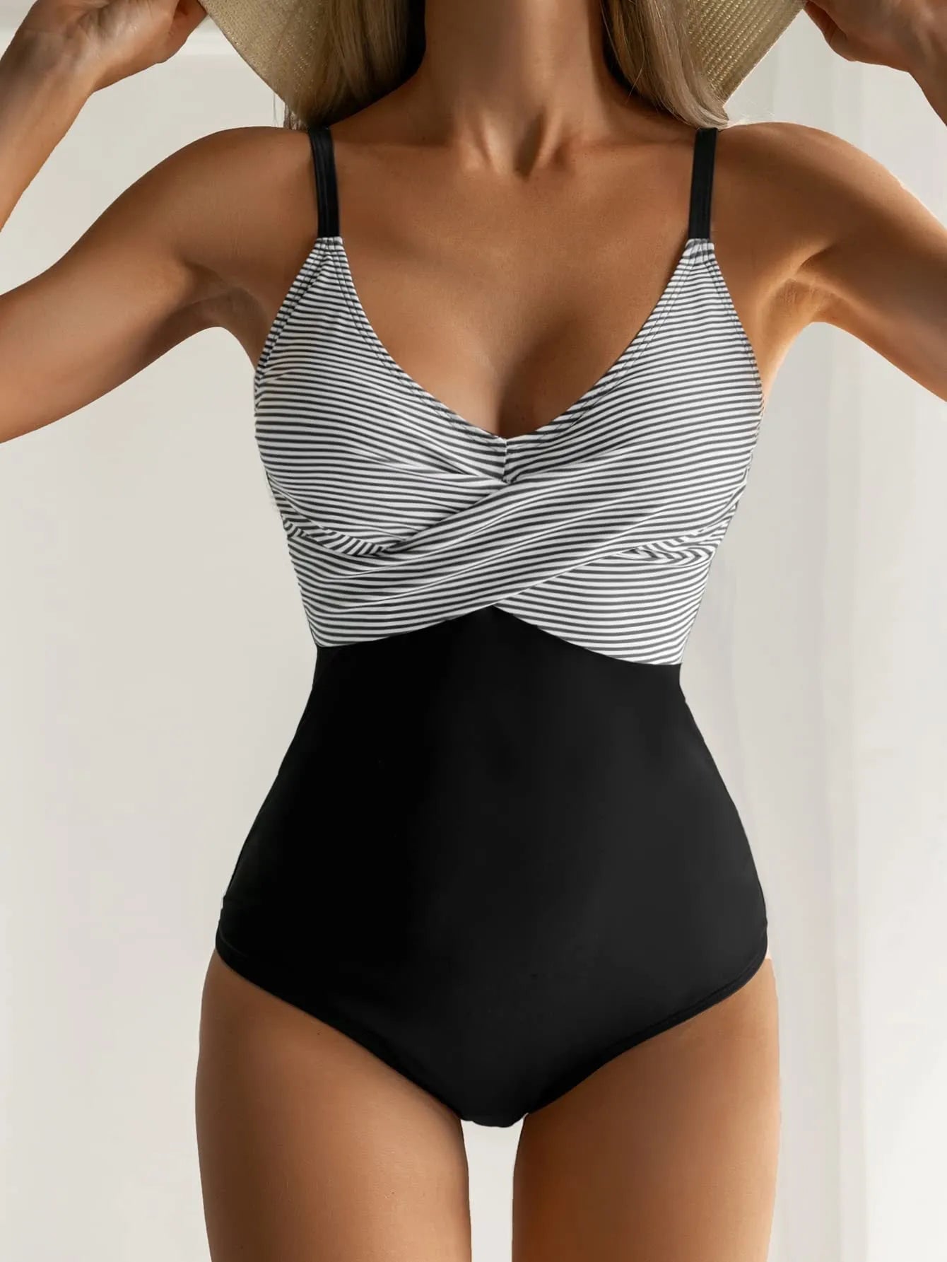 Women's lace-up back one-piece swimsuit in leopard print pattern, showing adjustable back design and sleeveless cut