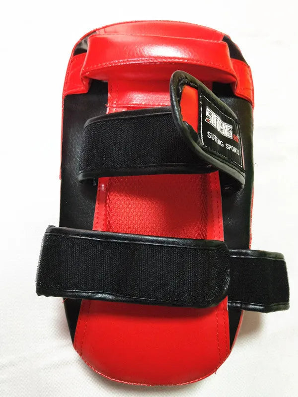 Black and red hand-held martial arts target pad showing double buckle strap on back