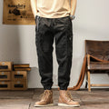 Men's khaki harem pants with tapered legs and ankle bands, made from non-iron cotton fabric.
