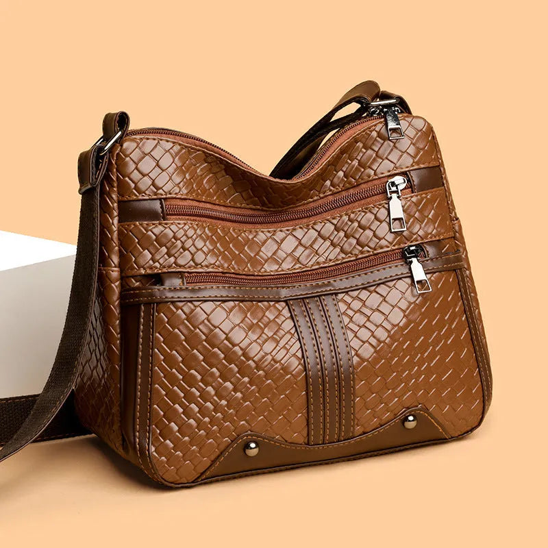 Woven PU messenger bag with horizontal square shape showing multiple compartments and internal zipper change pocket