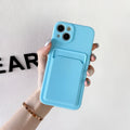 Sky blue silicone iPhone case with a card slot on the back, shown on a mobile phone.