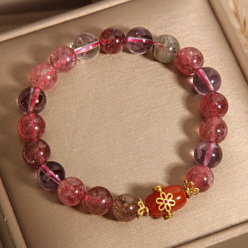 Super Seven crystal bracelet with white crystal and red agate accents on adjustable chain
