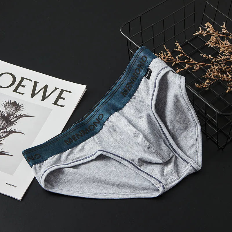 Men's low-waist cotton briefs in solid colours with a briefs style, showing breathable fabric and low-waist design.