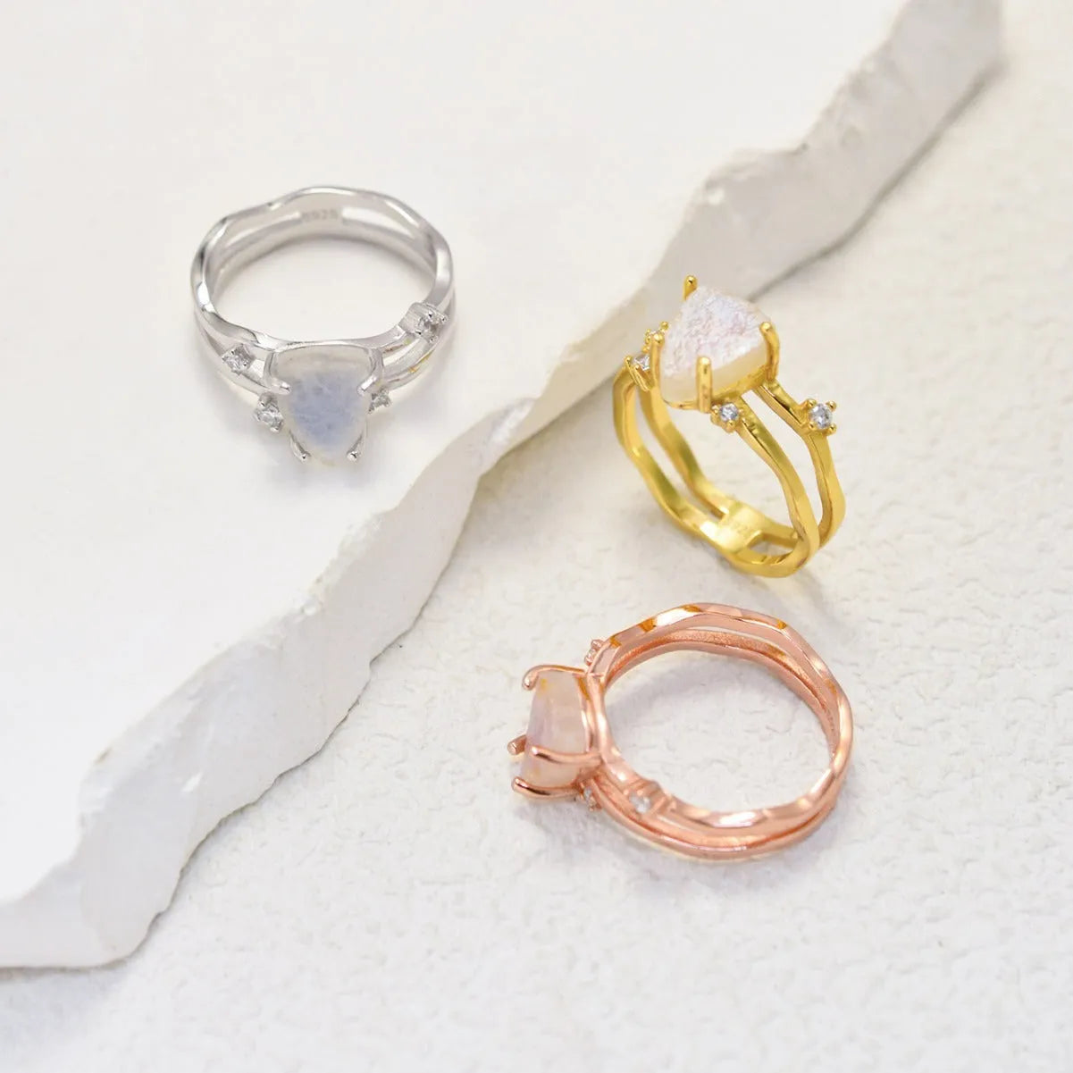 S925 sterling silver irregular triangle moonstone ring in rose gold finish on a hand