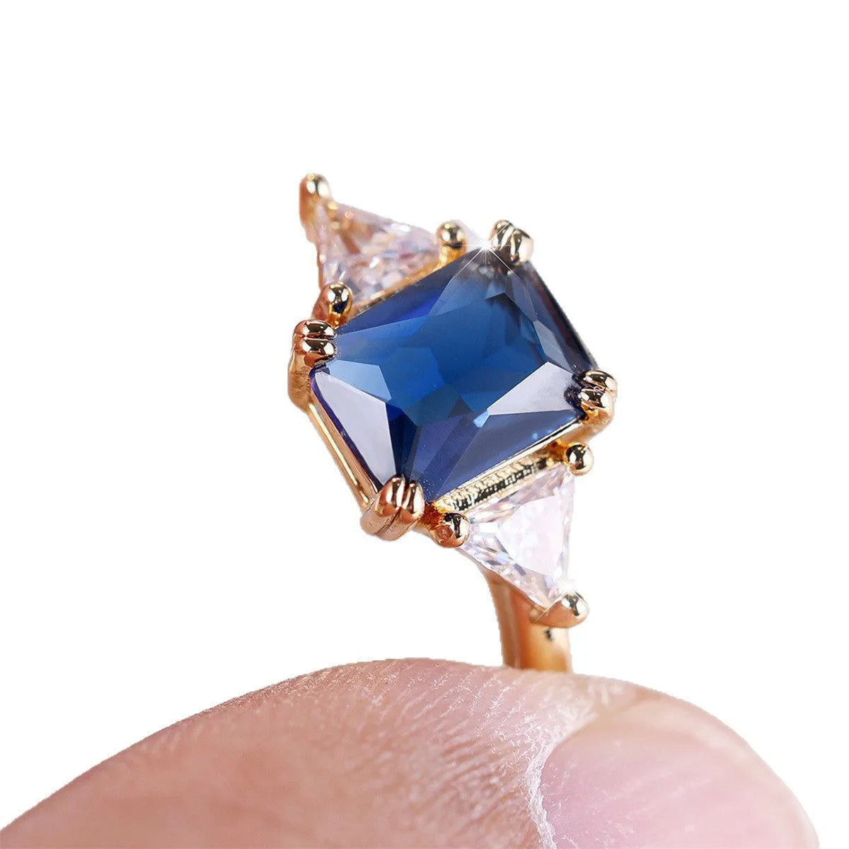 Gold sapphire blue rectangular copper ring for women showing geometric shape and metallic finish