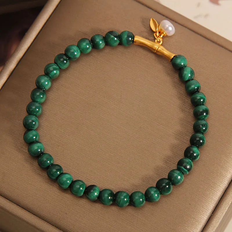 White crystal lucky bamboo bracelet for women with a high-rise design on a wrist.