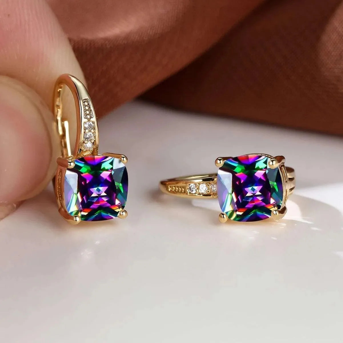 Geometric quadrilateral ear clips with moissanite inlays and electroplated copper construction in gold finish