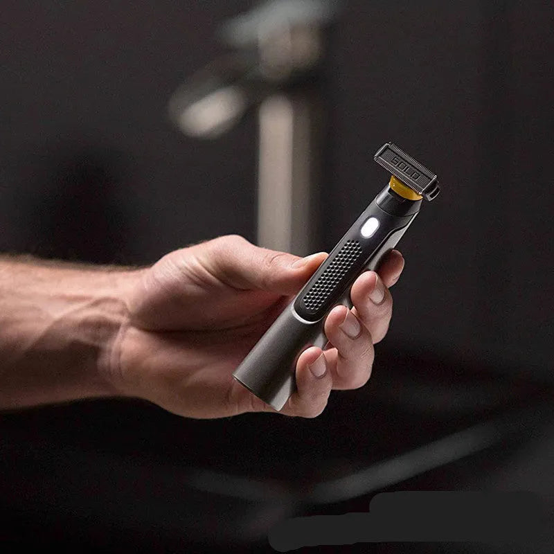 Black wireless rechargeable precision shaver with stainless steel blades, measuring 15cm long with ergonomic handle