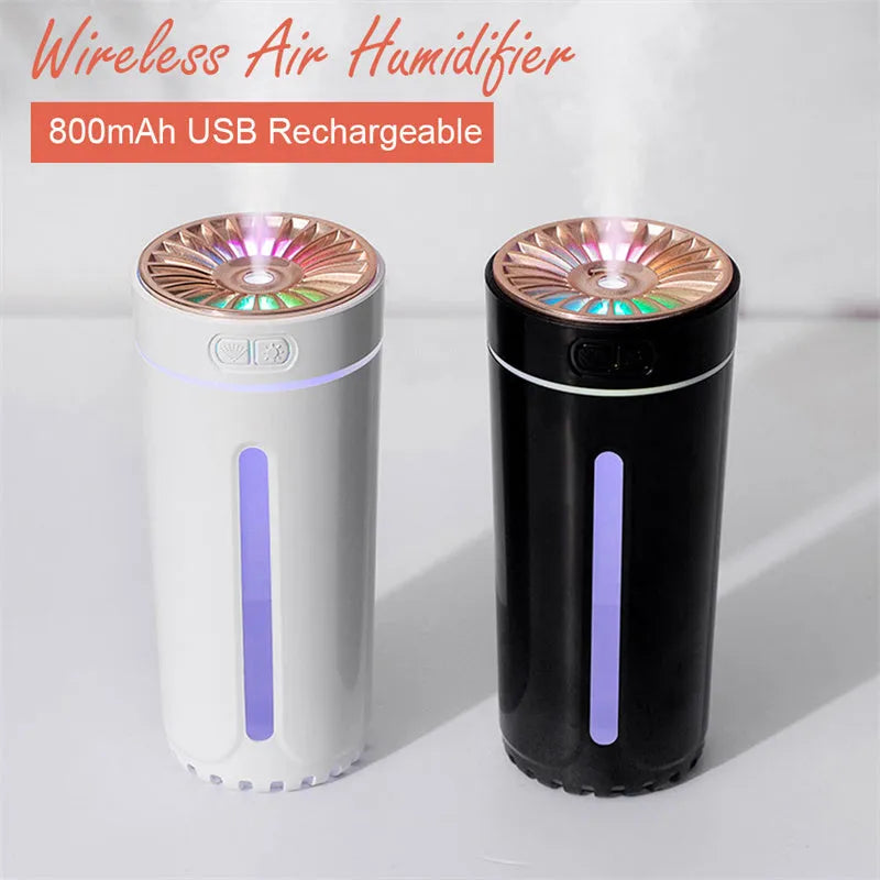 Black portable USB rechargeable humidifier with colourful LED lights on a car cup holder.