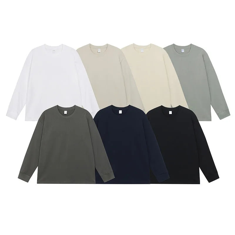 Men's simple solid colour long sleeve cotton t-shirt shown in loose fit on a hanger.