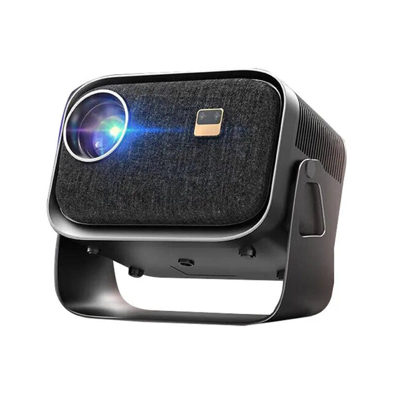 Portable Android 4K Full HD home projector with mobile phone on a table.
