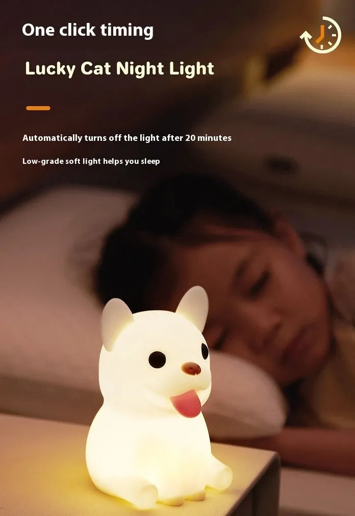 Silicone cartoon bull night light with USB port for charging and dimming controls.