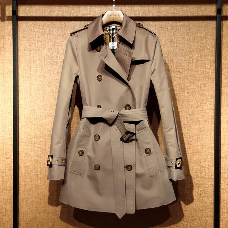 Khaki women's trench coat with double-breasted button front and distinctive flight sleeves