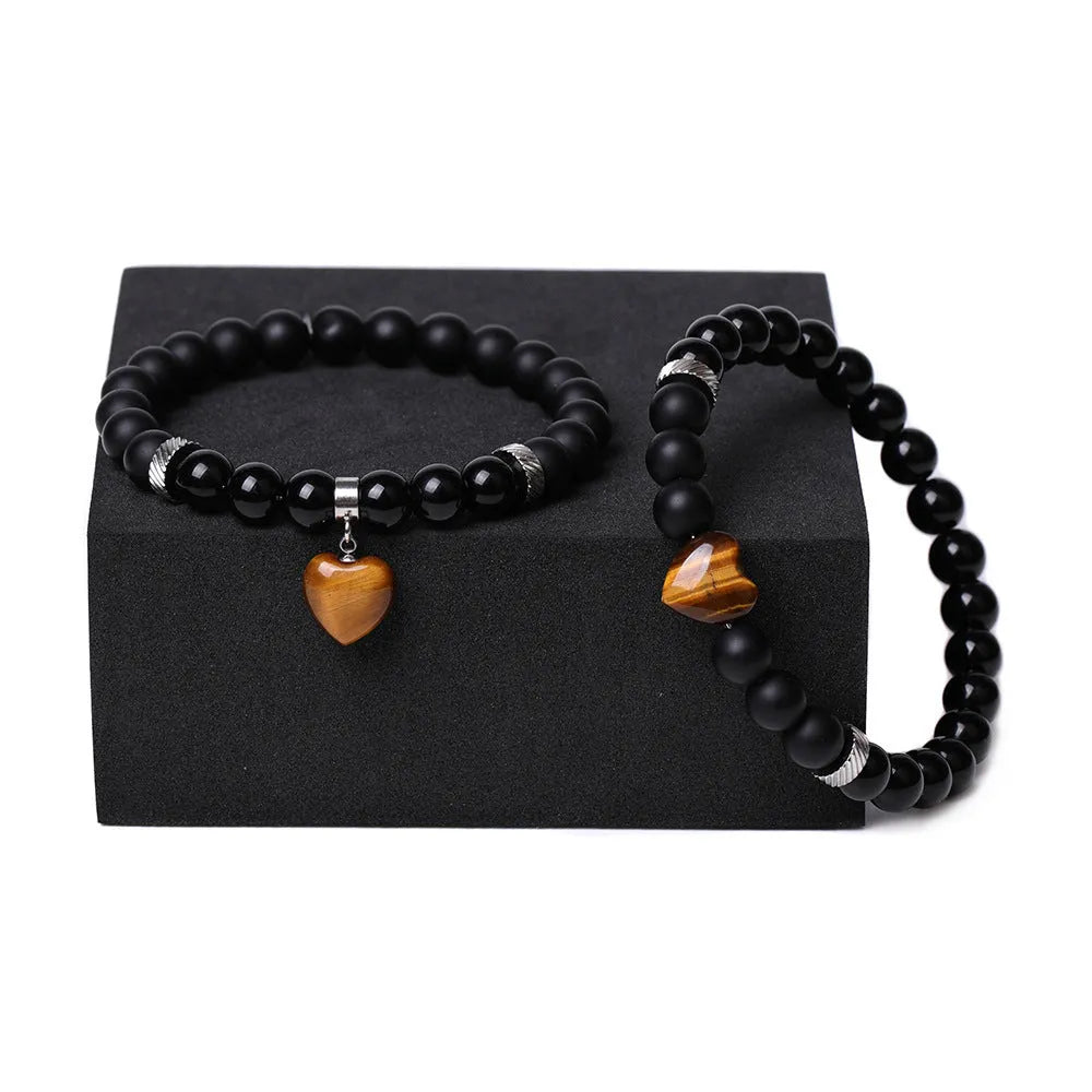 Matching natural stone couple bracelets with polished gemstone heart pendants