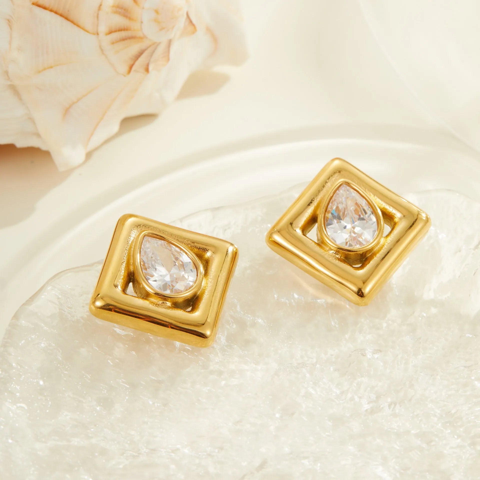 Gold geometric stud earrings with inlaid water drop zircon stones