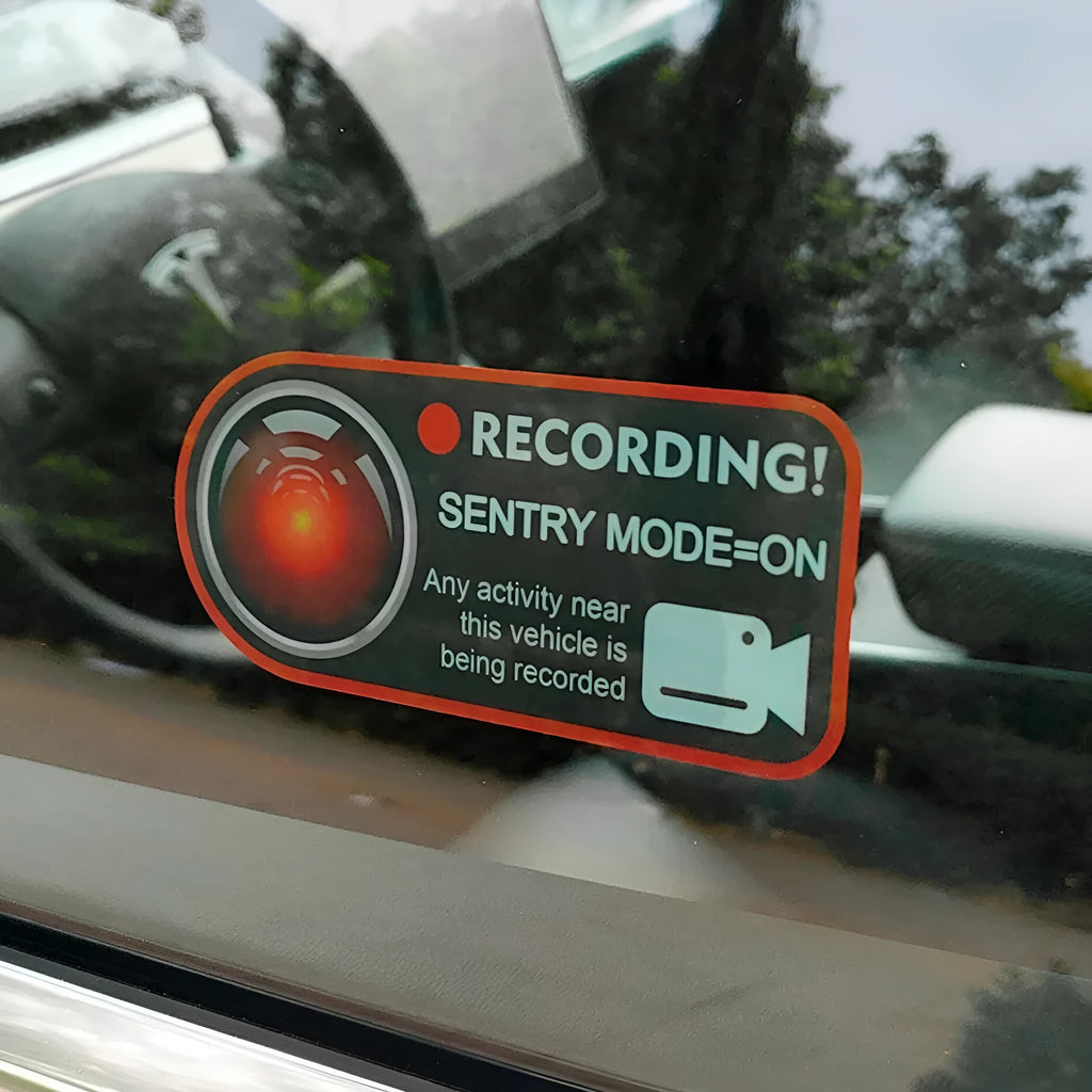 Tesla Sentry Mode electrostatic warning sticker measuring 11 by 5 centimetres