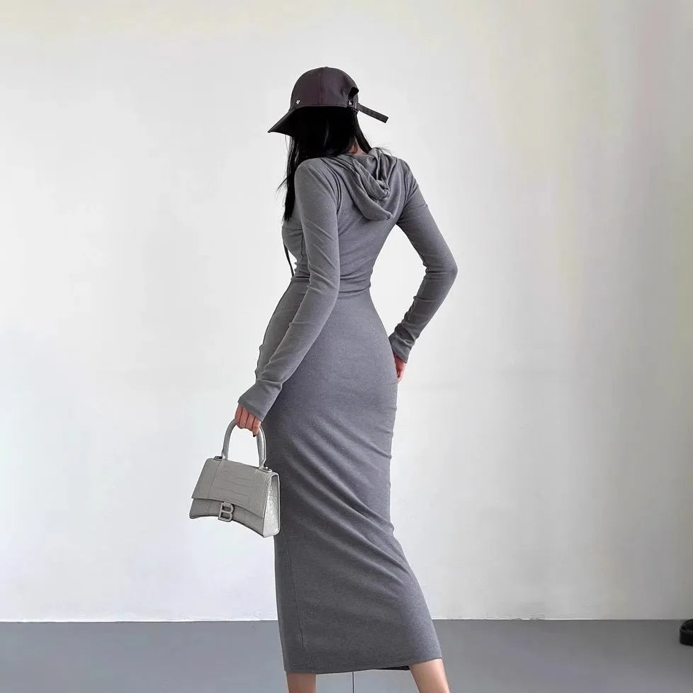 Women's grey hooded sheath dress with over-the-knee length and long sleeves showing high waist design