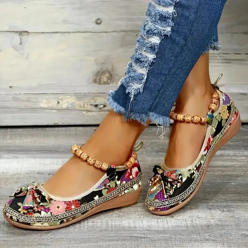 Black and red women's plus-size ethnic platform sandals with a cloth upper and elastic band.