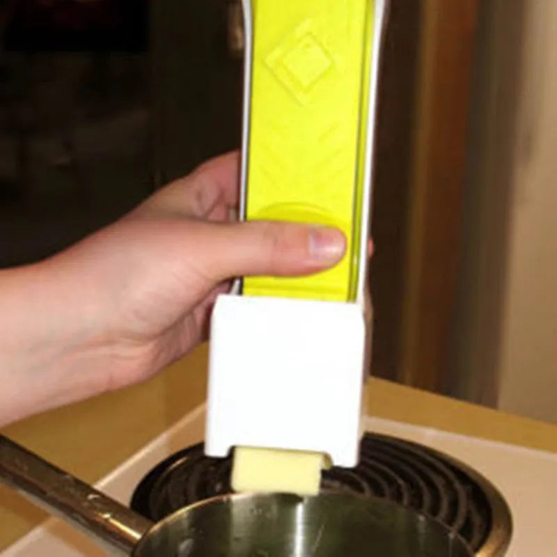Yellow plastic butter slicer and storage box with a one-button dispenser for standard 4.75 inch butter bars.