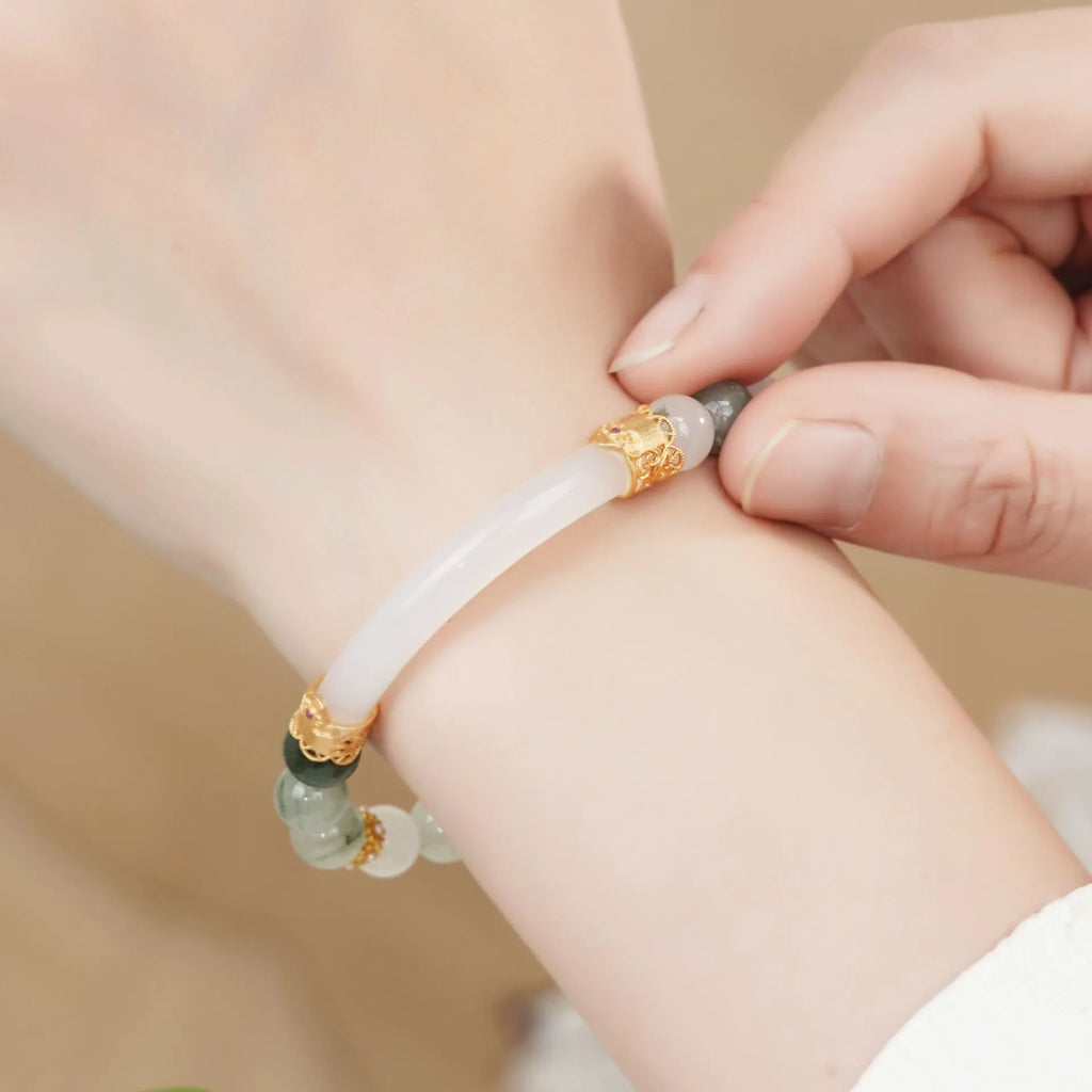 Emerald green Tian Shan jadeite half bracelet with floating flower girl design and round elements