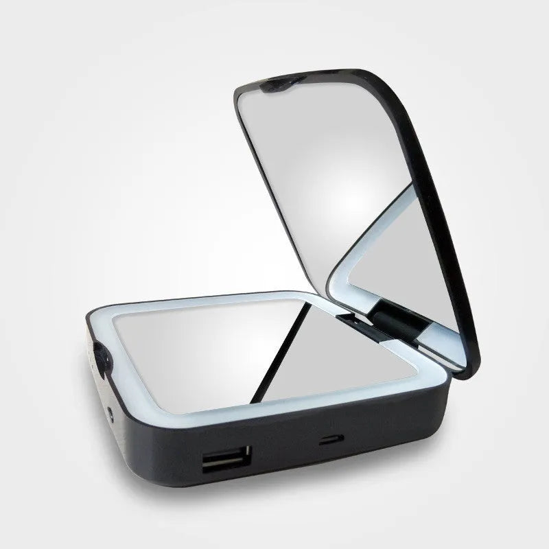Black lighted makeup mirror with dual magnification showing 4x and HD sides, adjustable lighting controls visible