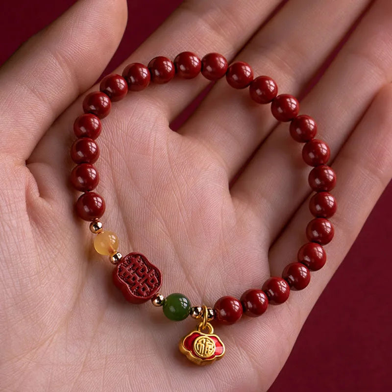 Handcrafted cinnabar bracelet with emperor sandstone beads and traditional fu character design in New Chinese style