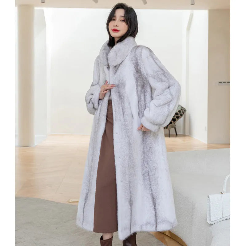 White women's faux fur coat with a stand-up collar, shown full-length.